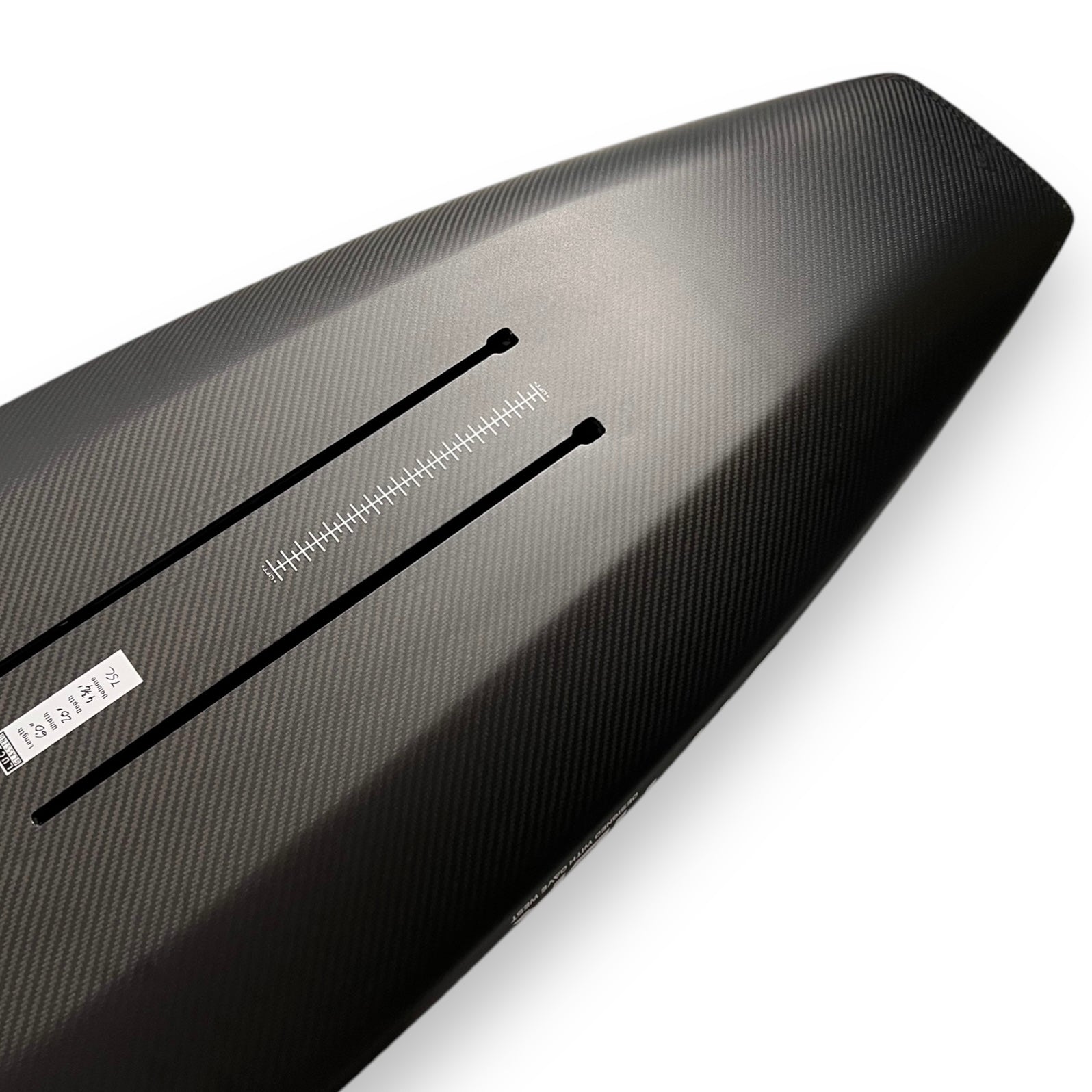 Bottom view of the tail of a black Cypher Wing / Parawing carbon foilboard by Amos Shapes showing its hydrofoil tracks