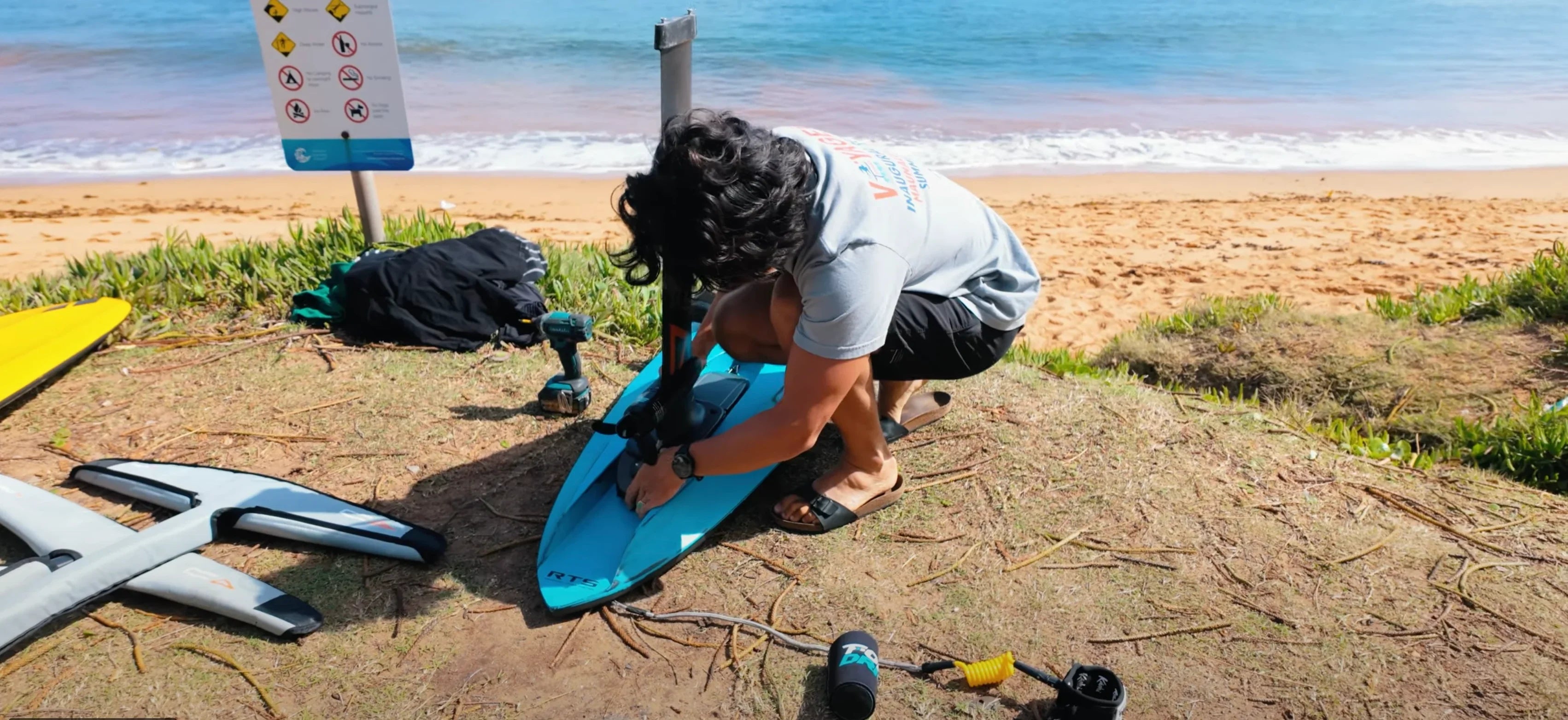 Man putting together Foil Drive hydrofoil board