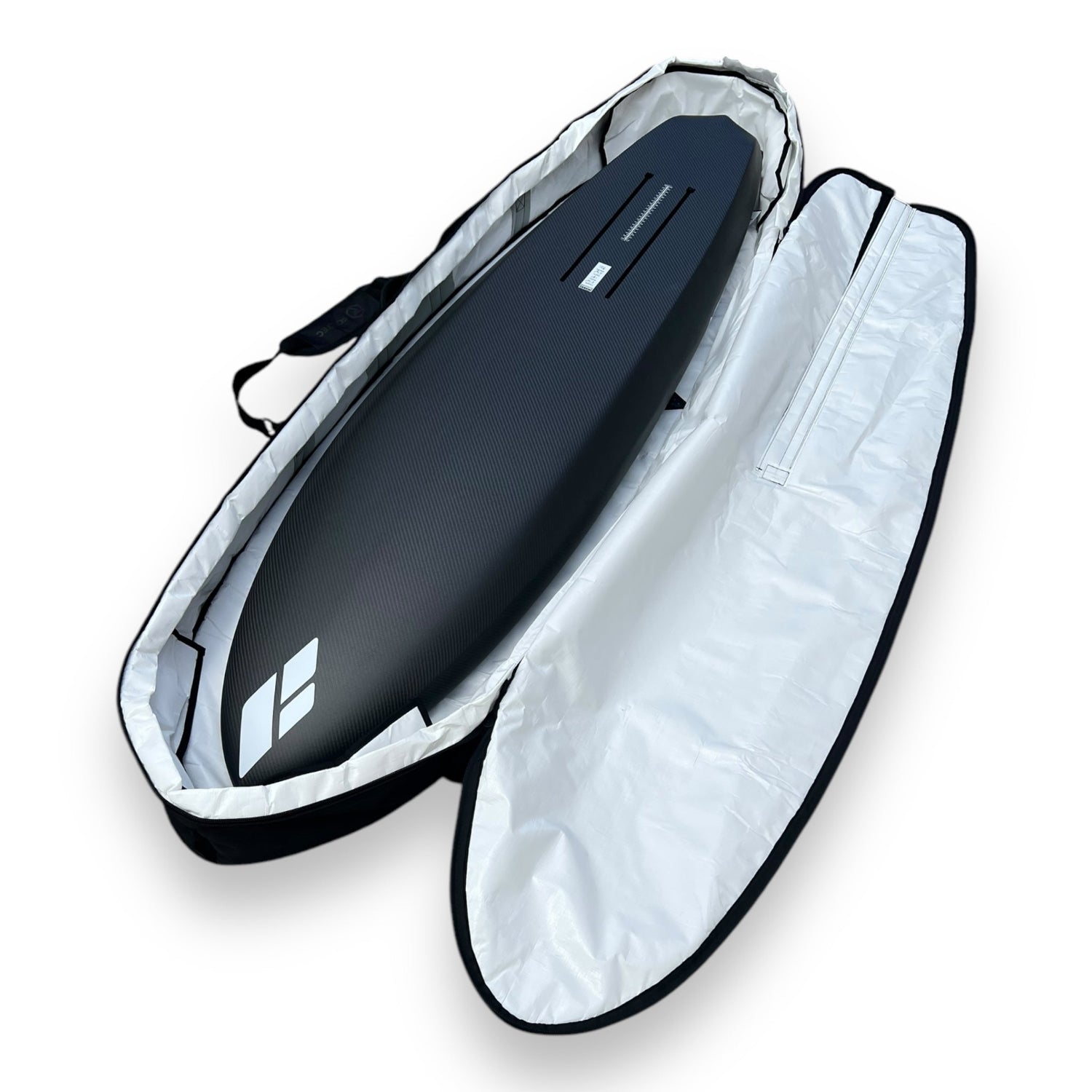 Full view of the bottom of a black Amos Shapes carbon foilboard inside a black Foil Tec foilboard travel bag with white lining