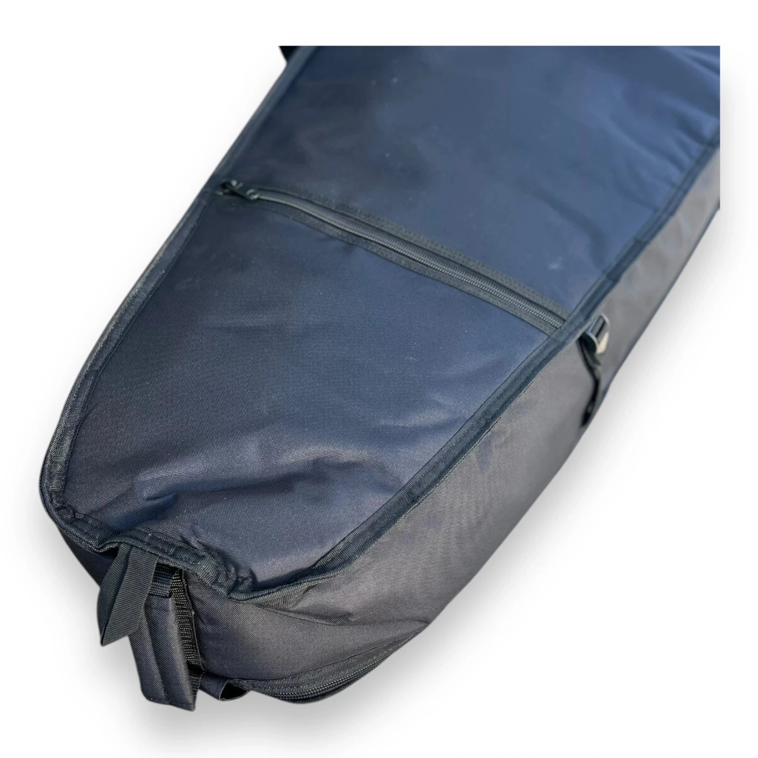 Bottom end of a black Foil Tec downwind foilboard travel bag showing its handle and zipper