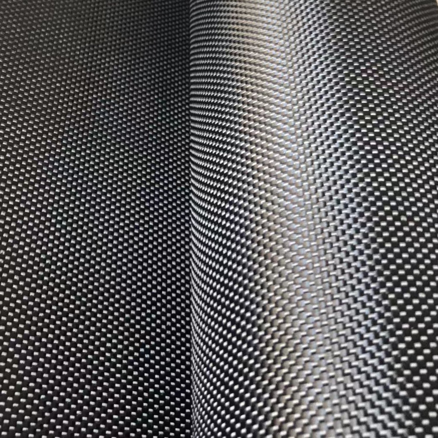 Close up shot of black plain weave carbon fibre cloth used to build carbon foilboards